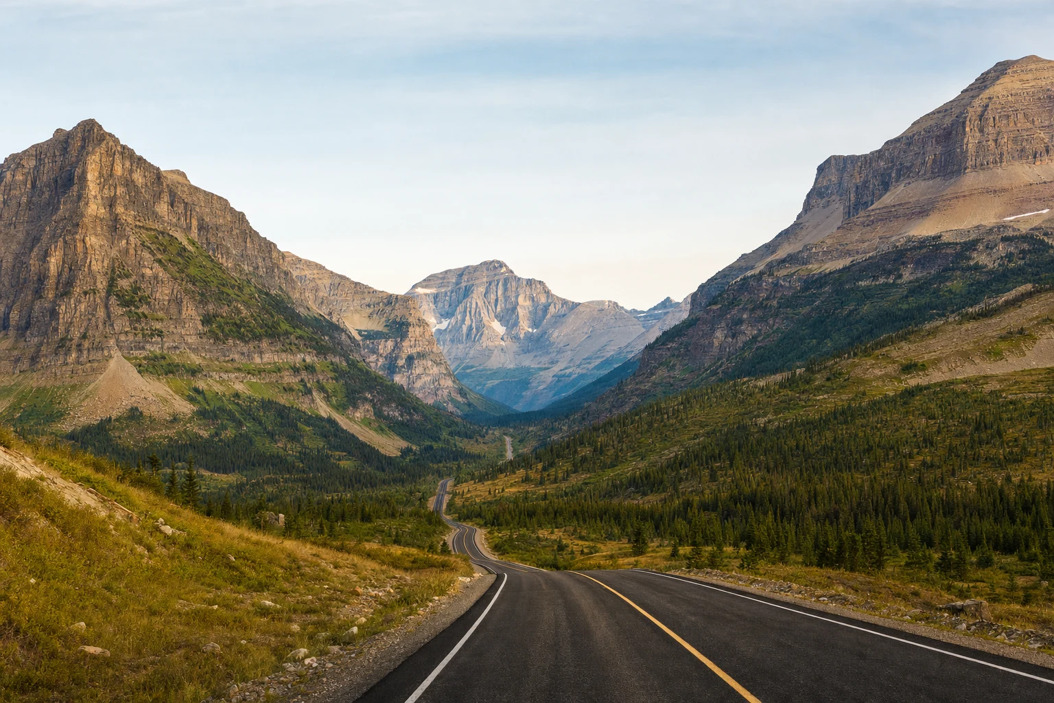 A serene mountain valley under even daylight with a clear open route, shown in a wide editorial landscape composition.